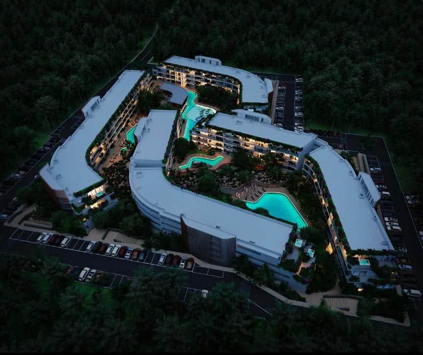 Aerial night pools hero at The Leaf Playacar