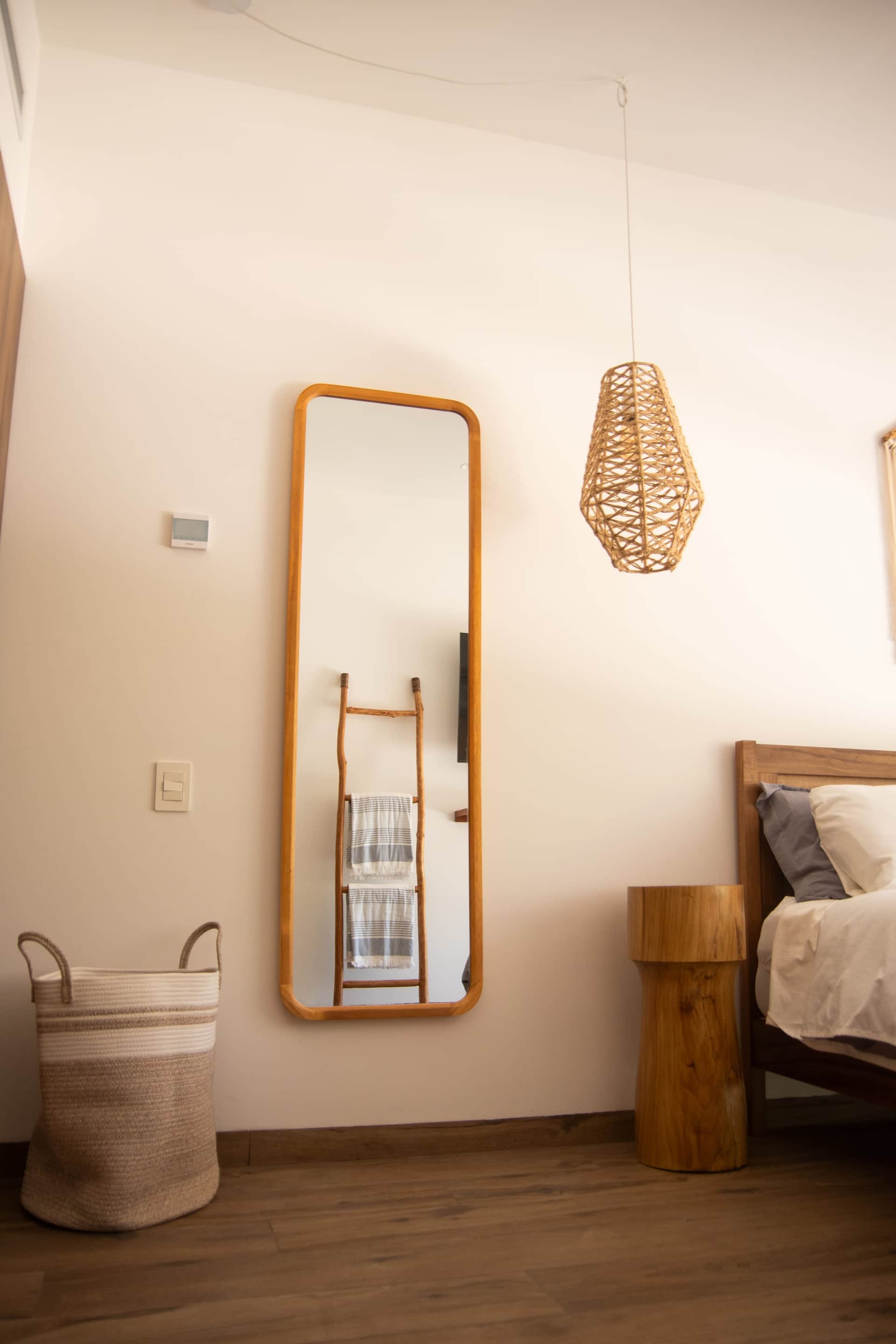 Flexible third bedroom with boho decor and woven pendant light at The Leaf Playacar