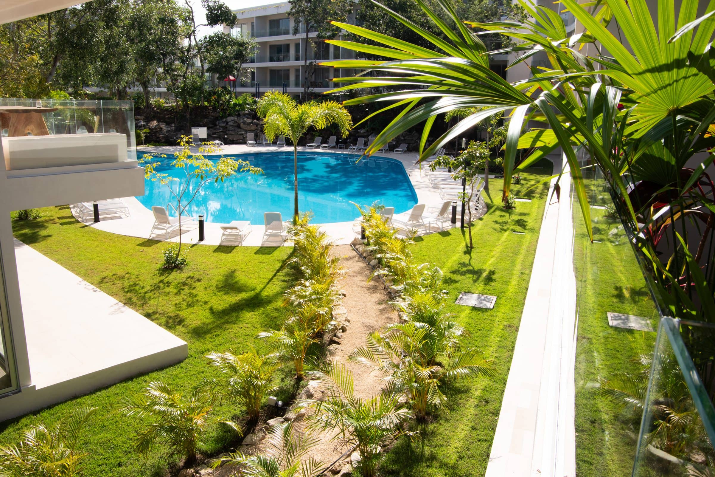 Aerial pool courtyard view from balcony at The Leaf Playacar