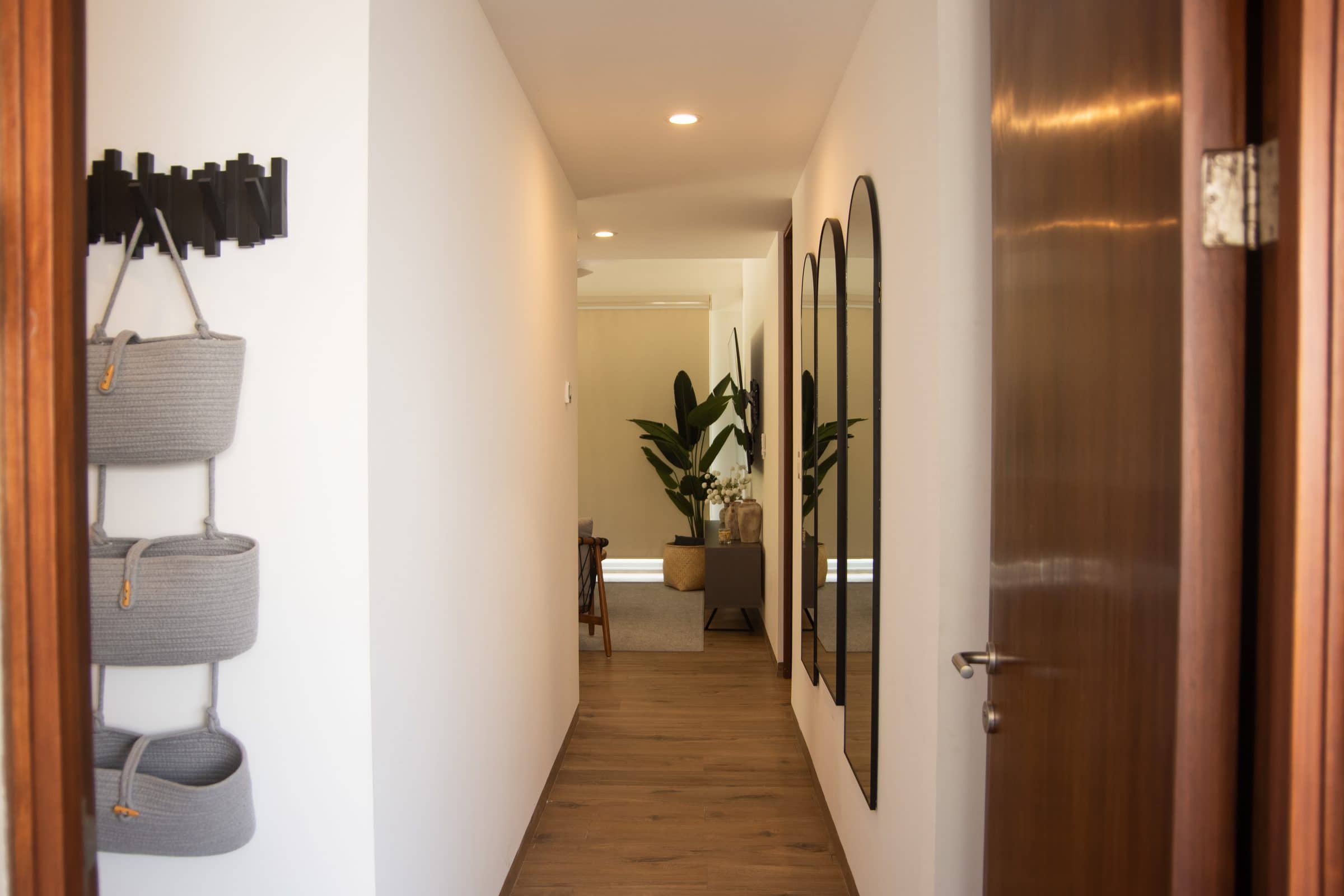 Modern hallway with arched mirrors at The Leaf Playacar